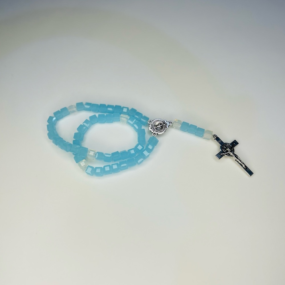 Child sized Rosary with baby blue glass beads.